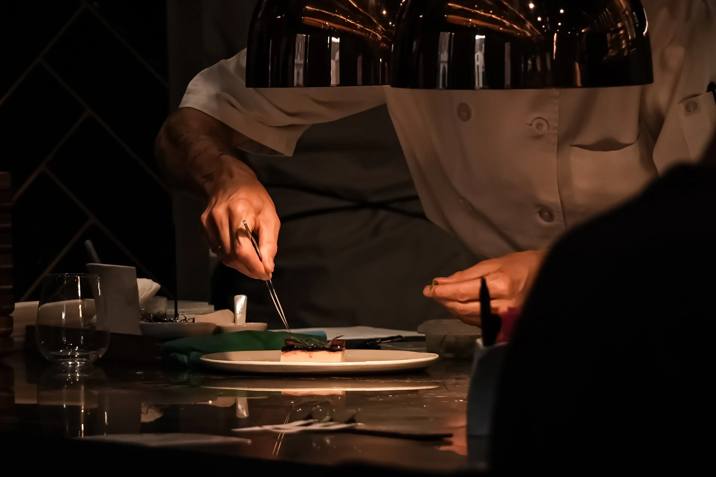 A chef at the Enigma Yorkville pass